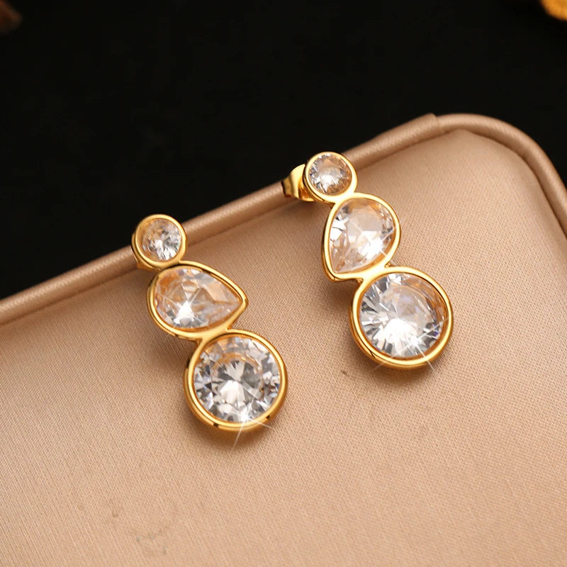 Brincos Scintilla dourados com três zircónias, foto 6